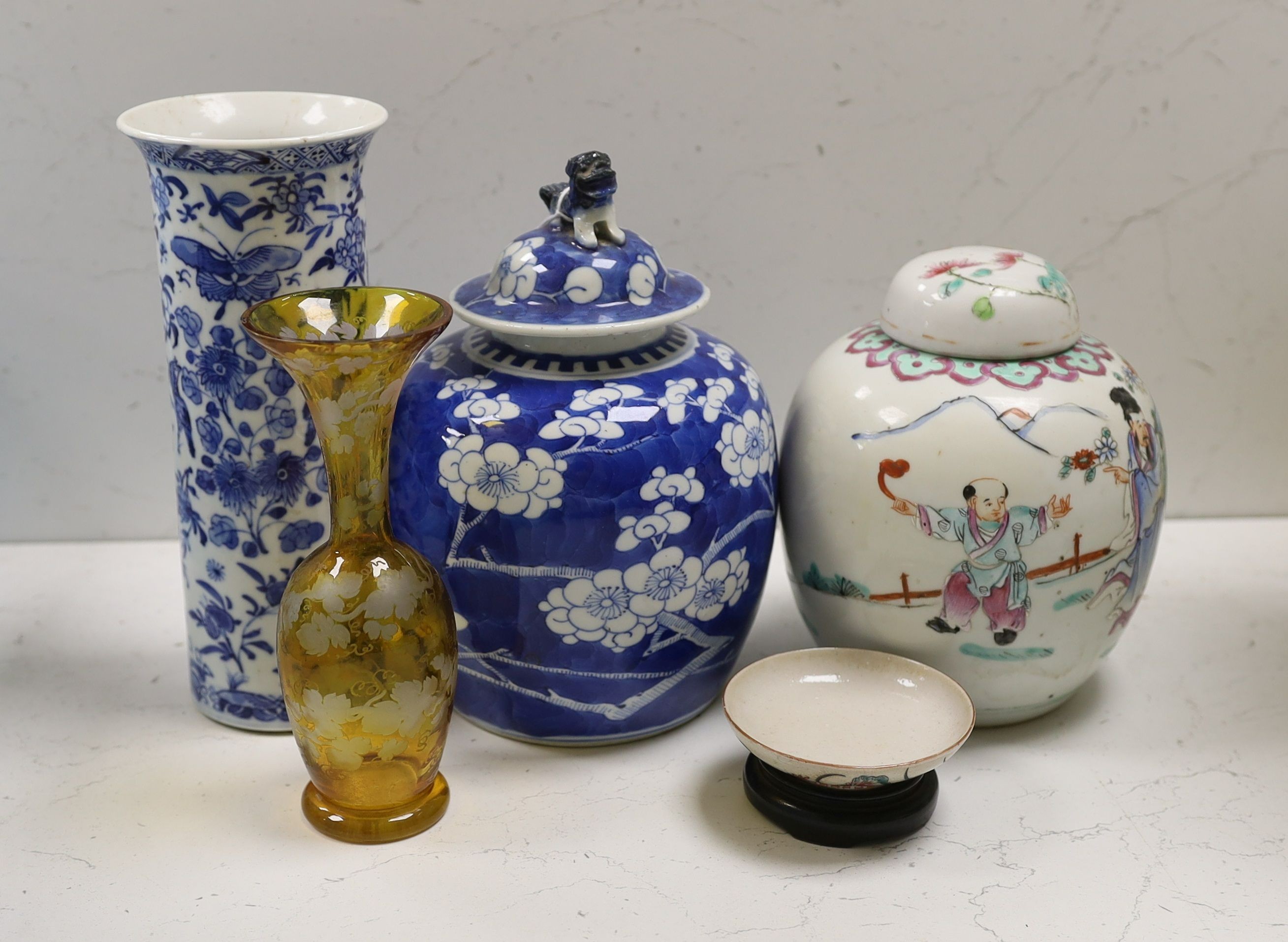 A Chinese famille rose ginger jar, a 19th century Chinese blue and white porcelain jar and cover, a blue and white cylinder vase, a small Chinese dish and orange glass vase (5)